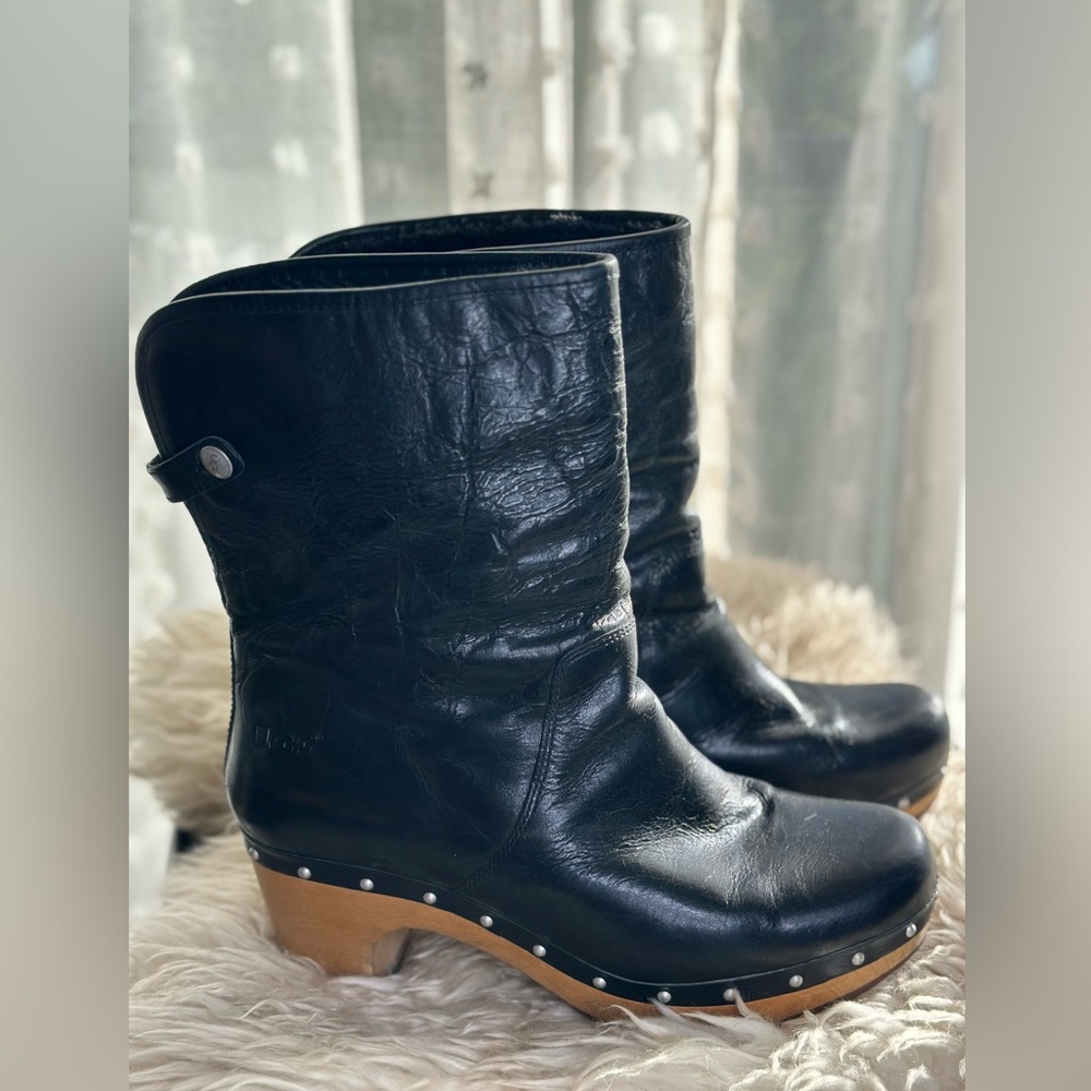 Black size 9 UGG Platform Clogs/ wooden sole with fuzzy sheepskin lining.